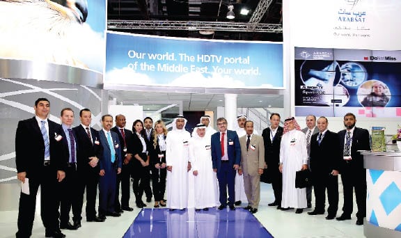 Arabsat CEO Khalid Balkheyour with members of the Arabsat team at CABSAT 2013 in Dubai.