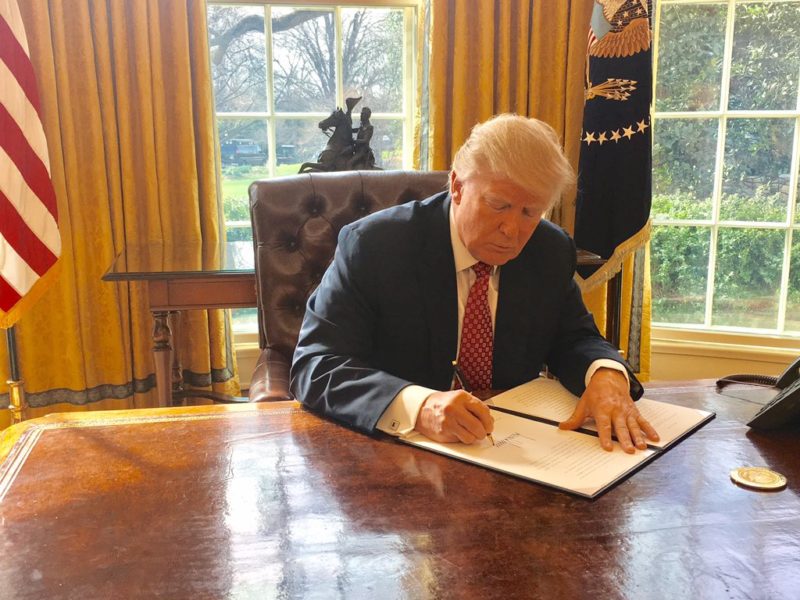 President Donald Trump signing Executive Order 13780. Photo: Wikimedia. 