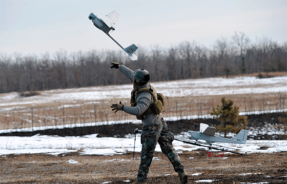 A Marine Corps operator launches a UAS. Photo: U.S. Naval Air Systems Command. 
