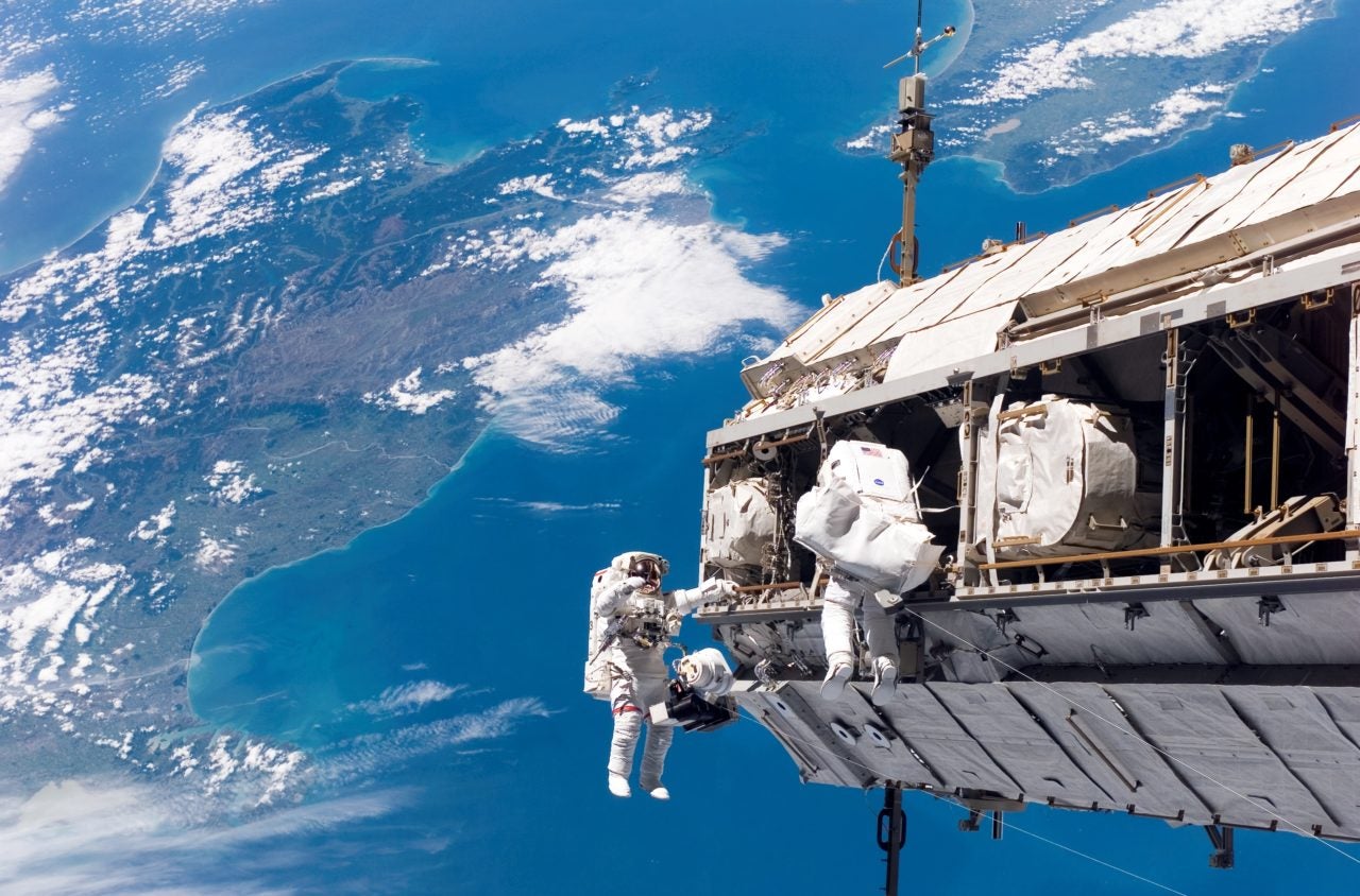 Astronauts spacewalk outside the International Space Station. Photo: Wikimedia. 