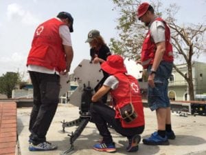 Red Cross volunteers setting up mobile VSATs to reconnect Puerto Rico after hurricane Maria