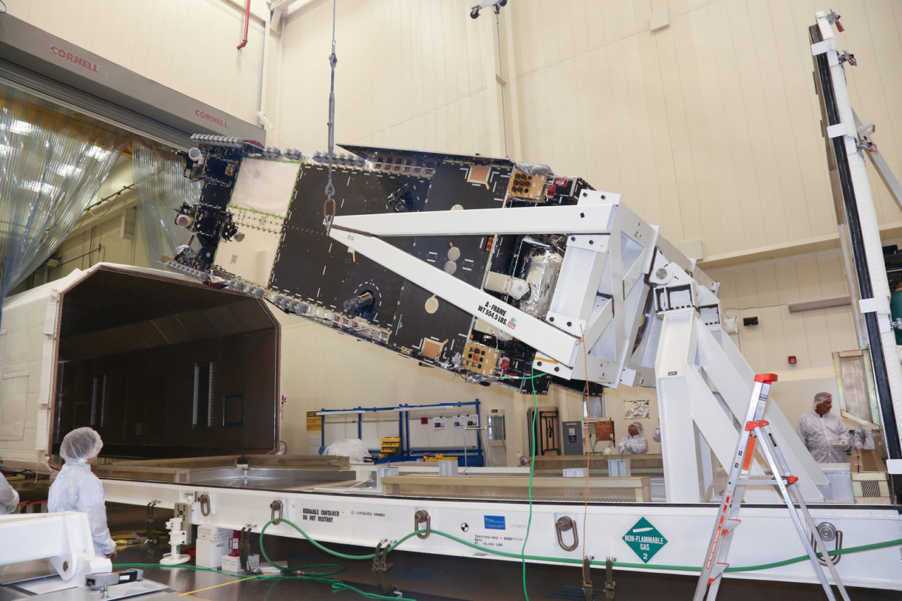 Lockheed Martin technicians loaded the Hellas-Sat 4/SaudiGeoSat 1 communications satellite into its shipping container for delivery to environmental testing in California. Photo: Lockheed Martin.