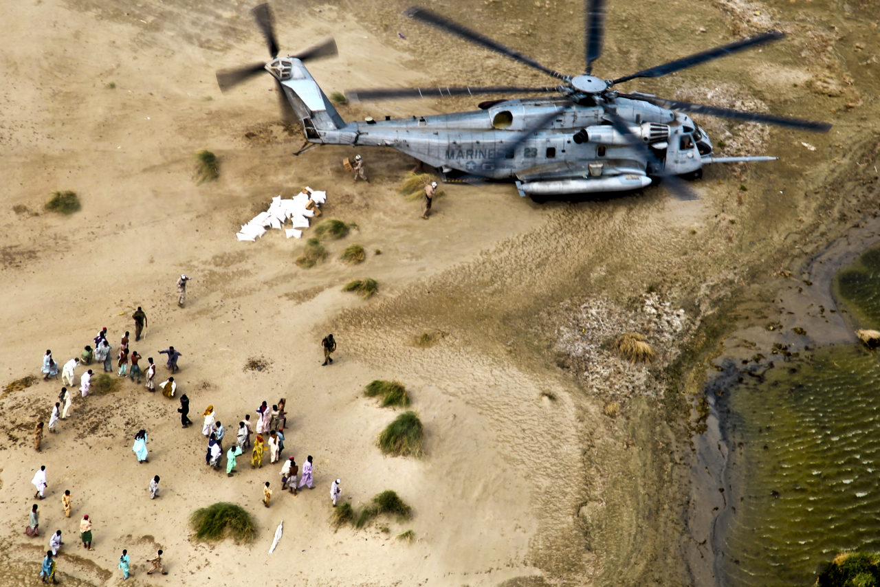 U.S. Marines from the 26th Marine Expeditionary Unit unload food and supplies to Pakistanis in support of the flood relief effort in Pano Aqil, Pakistan, Sept. 11, 2010. Photo: U.S. Army/Sgt. Jason Bushong.