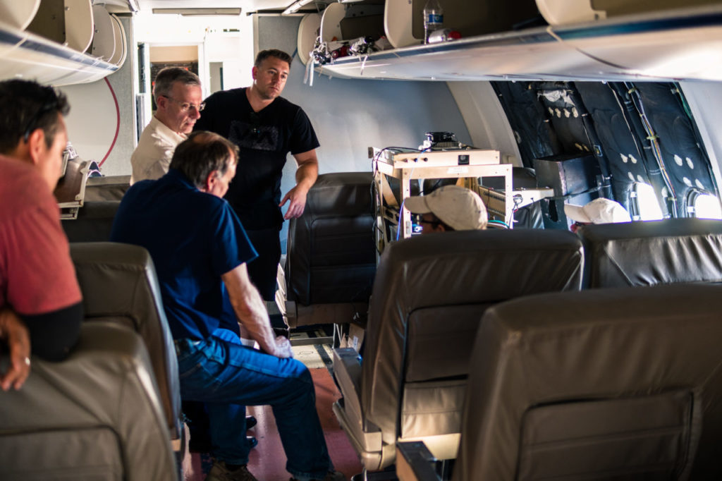 The AWN team flight testing its airborne mesh network concept in a reconfigured aircraft.