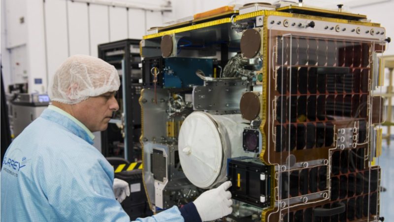 A University of Surrey engineer inspects the RemoveDebris spacecraft. Photo: University of Surrey/Matt Alexander.