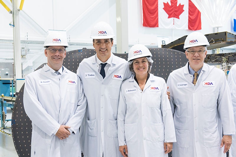 Canada Prime Minister Justin Trudeau joins MDA leaders to view the RADARSAT Constellation Mission satellites. Photo: Business Wire