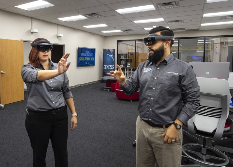 Information Technology Assistant Melinda Anthony and Electrical Engineer AJ Tate engage with augmented reality at Lockheed Martin's Orlando Innovation Center. Photo: Lockheed Martin