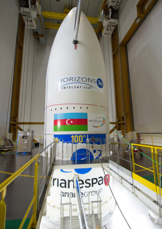 The completed Ariane 5 launch vehicle is shown inside the Spaceport’s Final Assembly Building sporting its various customer and mission logos. Photo: Arianespace