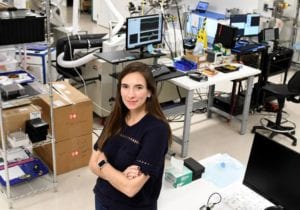 Natalya Bailey, CEO of Accion Systems, a company that develops small propulsion systems for satellites, is seen in the company’s research lab, Nov. 9, in Boston, after lift-off last week of a satellite using their technology. Photo: Jim Michaud