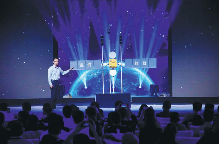 An Yang, chief scientist of LinkSure's satellite project, introduces the company's satellite system at a press conference in Beijing. Photo: China Daily