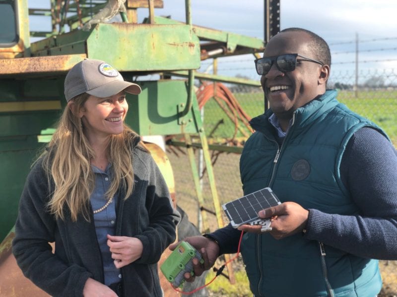 Stephanie Tatge, ecosystem services analyst for The Freshwater Trust and Nathan B Wangusi, technical lead for Water Research, IBM Research - Africa, holding a low-cost satellite sensor from SweetSense. Photo: IBM