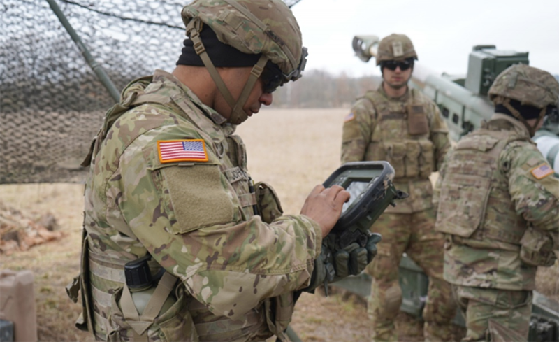 U.S. Army Soldier with the Field Artillery Squadron, 2d Cavalry Regiment utilizes the defense advanced GPS receiver to receive data during a dry run of the M77 Howitzer fire drill during the Dynamic Front 2019 training in Grafenwoehr Training Area, Germany, March 6, 2019. Photo: U.S. Army, Sgt. LaShic Patterson
