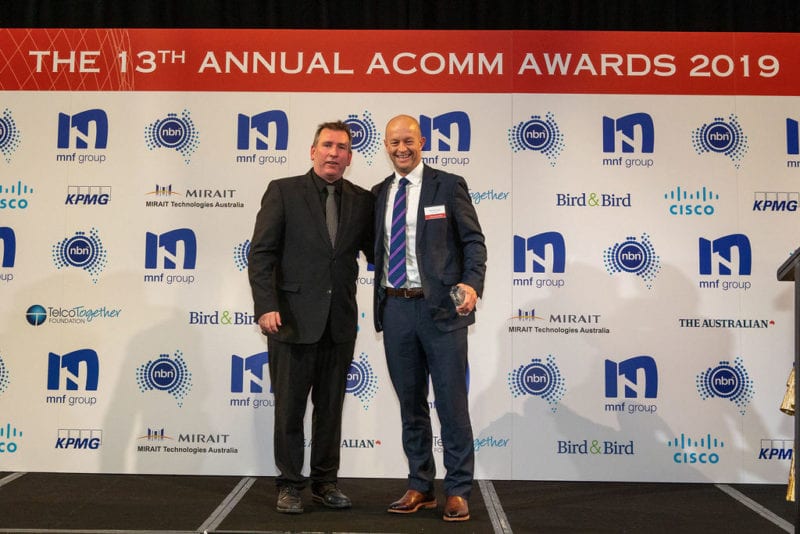 Hamish Lee, VP Sales APAC, Speedcast, receiving the ACOMM award. Photo: Speedcast