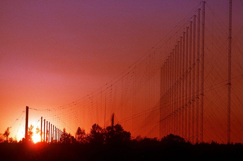 An antenna network at the Navy Satellite Communications Facility is silhouetted against the late afternoon sky. Photo: U.S. National Archives
